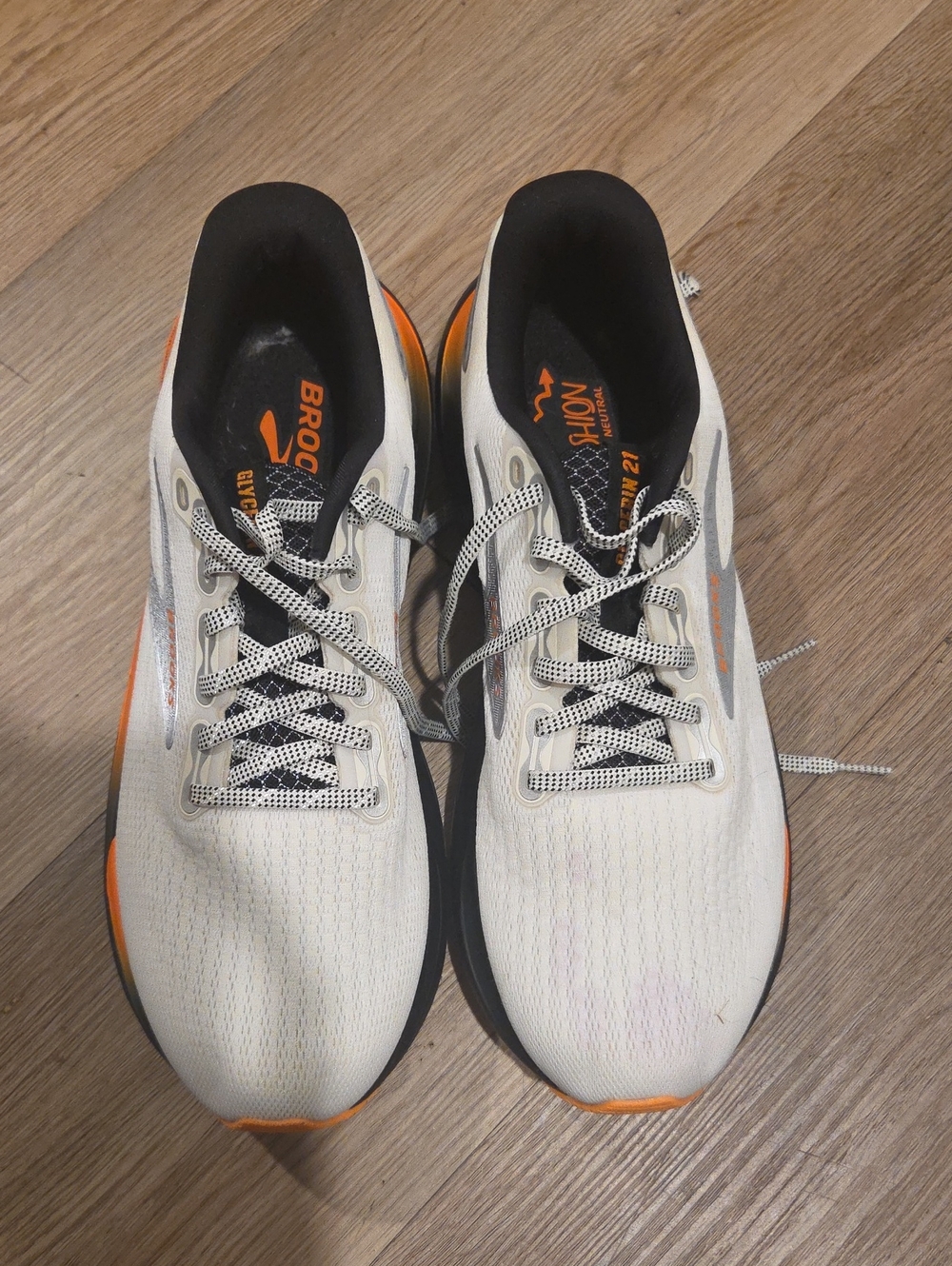 Brooks Men’s White and Orange Athletic Running Shoes Purple Stain On Left Shoe